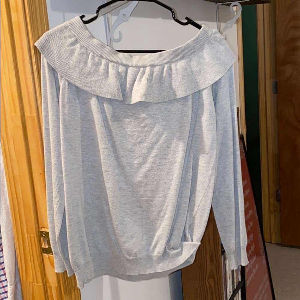 Very cute sweater. Dress it up with 👖 and boots.